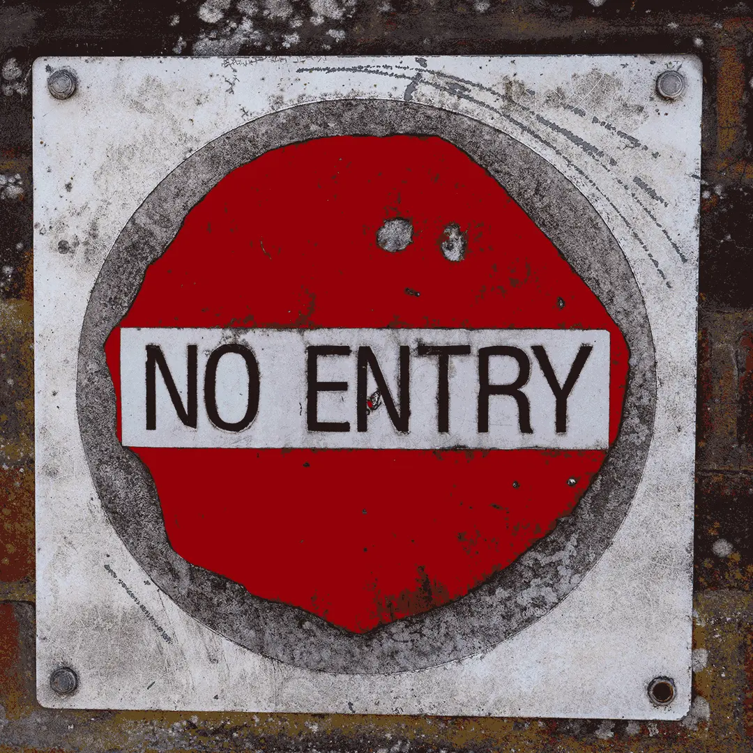An old, metal No Entry sign